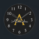 Black Gold Modern Script Girly Monogram Name Round Clock<br><div class="desc">Black and Gold Simple Script Monogram Name Clock. This makes the perfect sweet 16 birthday,  wedding,  bridal shower,  anniversary,  baby shower or bachelorette party gift for someone that loves glam luxury and chic styles.</div>