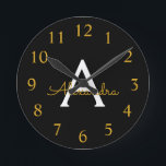 Black Gold Modern Script Girly Monogram Name Round Clock<br><div class="desc">Black and Gold Simple Script Monogram Name Clock. This makes the perfect sweet 16 birthday,  wedding,  bridal shower,  anniversary,  baby shower or bachelorette party gift for someone that loves glam luxury and chic styles.</div>