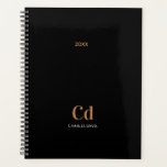 Black gold monogram initials 2025 planner<br><div class="desc">Stay stylishly organised with the "Black Gold Monogram 2025 Planner." This sleek and modern planner combines timeless black with elegant gold accents, creating a sophisticated design that’s perfect for personal or professional use. The customisable monogram feature allows you to add your initials, making it uniquely yours or an ideal gift...</div>