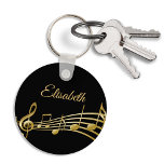 Black gold music notes monogram name key ring<br><div class="desc">Simple and elegant for a music lover! Black background with faux gold music notes. Template for your name,  golden hand lettered style script.</div>