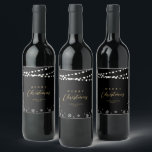 Black & Gold String Lights Snow Merry Christmas Wine Label<br><div class="desc">Celebrate the season with this stylish custom Christmas wine label. This label design features "Merry Christmas" text and a festive snowflake and string lights background. You can personalise the text. More holiday stationery and party supplies are available at my shop BaraBomDesign.</div>