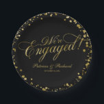 Black Gold We're Engaged Engagement Party Paper Plate<br><div class="desc">Elegant calligraphy engagement party paper plate. Easy to personalise with your details. Please get in touch with me via chat if you have questions about the artwork or need customisation. PLEASE NOTE: For assistance on orders,  shipping,  product information,  etc.,  contact Zazzle Customer Care directly https://help.zazzle.com/hc/en-us/articles/221463567-How-Do-I-Contact-Zazzle-Customer-Support-.</div>