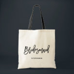 Black Hand Lettering Bridesmaid I Personalised Tote Bag<br><div class="desc">Customisable bridesmaid tote bag. Modern and classic tote bag featuring black "bridesmaid" hand lettering script. Personalise by adding the receiver's name,  the hashtag of the wedding or other details. Perfect as a gift for your wedding party or bridal party.</div>