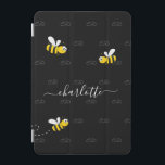 Black happy bumble bees summer fun humour monogram iPad mini cover<br><div class="desc">Decorated with happy, smiling yellow and black bumble bees. A chic black background. Personalise and add a name and your monogram, initials. The monogram in grey as a pattern in the background. The name is written in white with a modern hand lettered stylie script with swashes. To keep the swashes...</div>