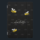 Black happy bumble bees summer fun humour monogram iPad pro cover<br><div class="desc">Decorated with happy, smiling yellow and black bumble bees. A chic black background. Personalise and add a name and your monogram, initials. The monogram in grey as a pattern in the background. The name is written in white with a modern hand lettered stylie script with swashes. To keep the swashes...</div>