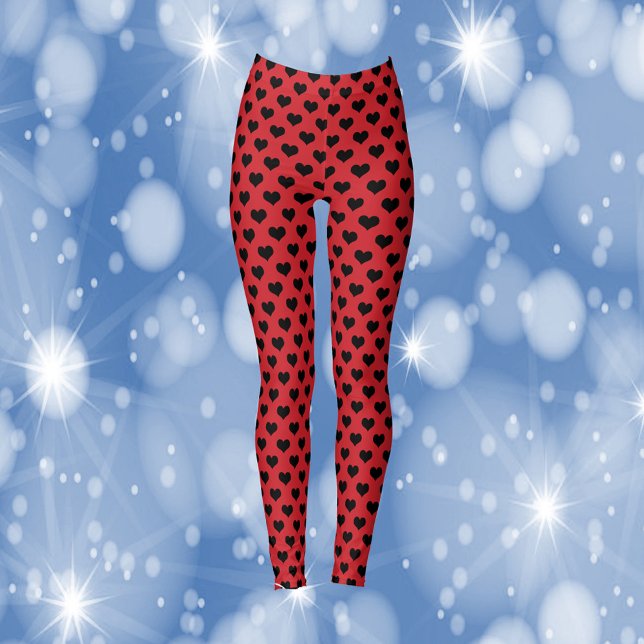 Black Hearts Pattern Red Background Leggings (A pair of leggings with a pattern of black hearts on a red background)