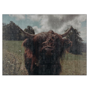 Black highland Scottish cow grazing vintage retro Cutting Board