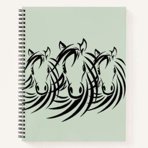 Black Horse Heads on Green Notebook