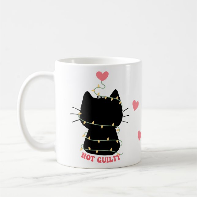 Black kitten not guilty of tangling with lights coffee mug (Left)
