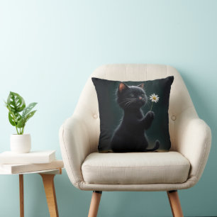 Black Kitten With a White Daisy Cushion