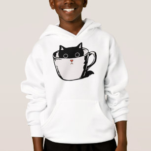 Black kitten with red nose hiding in a cup