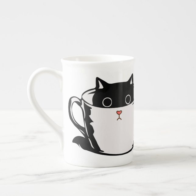 Black kitten with red nose hiding in a cup (Left)