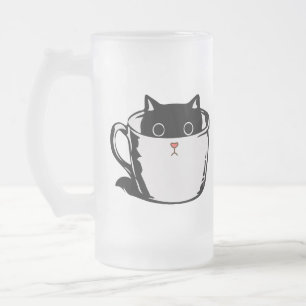 Black kitten with red nose hiding in a cup
