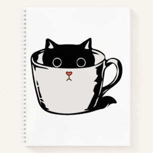 Black kitten with red nose hiding in a cup notebook