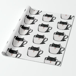 Black kitten with red nose hiding in a cup wrapping paper