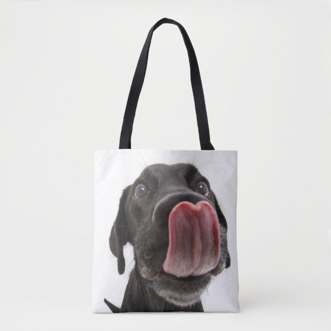 Black Labrador Licking Its Nose Tote Bag (Front)