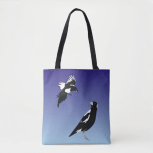 Black magpie birds on blue background tote bag