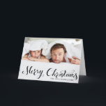 Black Merry Christmas Script Holiday Photo Card<br><div class="desc">Merry Christmas! Send your warm holiday greetings to family and friends with this customizable Christmas card. It features a modern calligraphy overlay. Personalize by adding your details. This photo Christmas card is available in other cardstock.</div>
