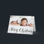 Black Merry Christmas Script Holiday Photo Card<br><div class="desc">Merry Christmas! Send your warm holiday greetings to family and friends with this customizable Christmas card. It features a modern calligraphy overlay. Personalize by adding your details. This photo Christmas card is available in other cardstock.</div>