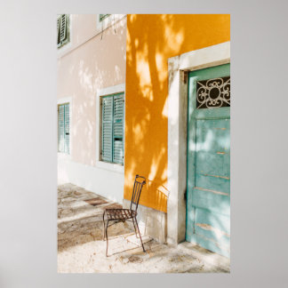 Black metal chair near dor poster