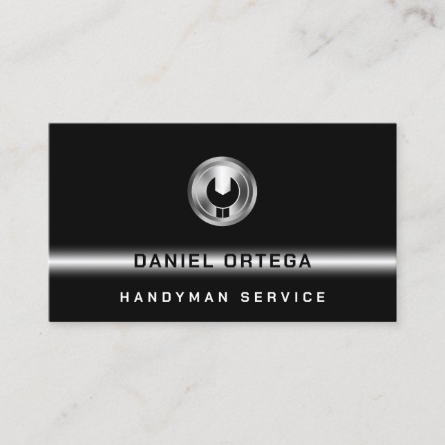 Black minimalist with wrench logo business card (Front)