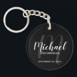 Black Modern Script Personalised Groomsmen Key Ring<br><div class="desc">Add a personal touch to your wedding with personalised groomsmen keychain. This keychain features personalised groomsmen's name in white modern script font style and monogram in grey modern script font style as background with title and wedding date in white modern sans serif font style on black background. Also perfect for...</div>