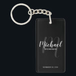 Black Modern Script Personalised Groomsmen Key Ring<br><div class="desc">Add a personal touch to your wedding with personalised groomsmen keychain. This keychain features personalised groomsmen's name in white modern script font style and monogram in light grey modern script font style as background with title and wedding date in white modern sans serif font style on black background. Also perfect...</div>