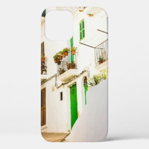 BLACK MOTORCYCLE NEAR WHITE WALL BUILDING AT DAYTI iPhone 12 CASE