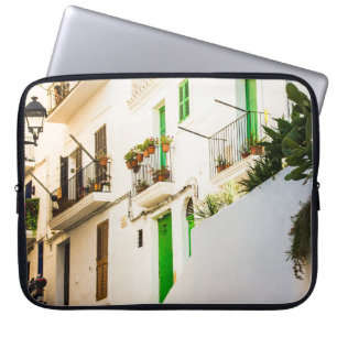 BLACK MOTORCYCLE NEAR WHITE WALL BUILDING AT DAYTI LAPTOP SLEEVE