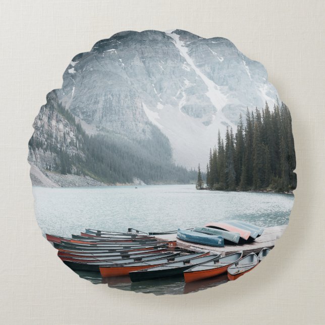 BLACK MOUNTAIN COVERED WITH SNOW UNDER GREY SKY ROUND CUSHION (Front)