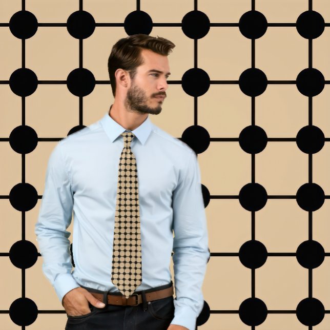 Black on Tan Dots and Grid Necktie (Man wears a necktie with a black grid pattern on tan.
)