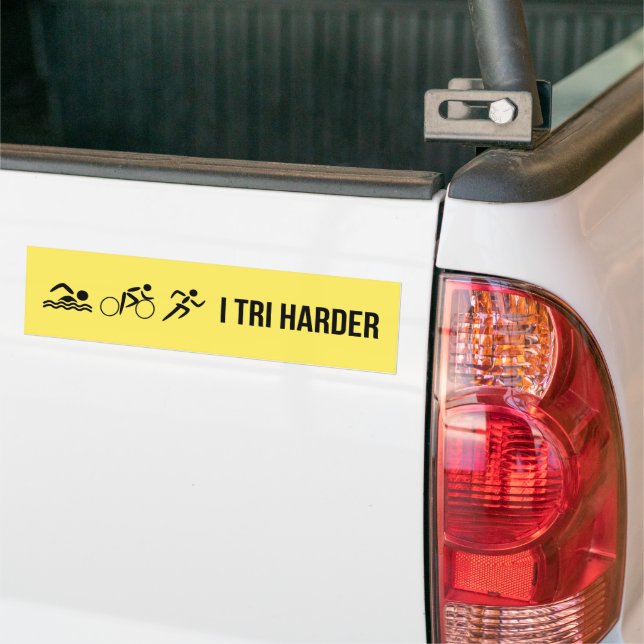 Black on yellow triathlon bumper sticker (On Truck)