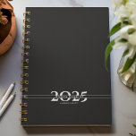 Black Overlapping Text Split Year Weekly Planner<br><div class="desc">Simple personal stationery 2025  annual/weekly planner featuring bold year digits split by a line of text (name,  subject,  etc). Annual planner (12 months) with open monthly overviews and weekly planning sheets. Cover in a curated selection of modern colours. Contact for assistance in personalising or creating special colour combination.</div>