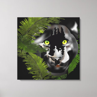 Black panther looking through foliage canvas print