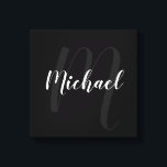 Black personalised Monogram and Name Canvas Print<br><div class="desc">Personalised Monogram and Family Name Gift
featuring name in white modern script font style and monogram in grey modern script font style as background on black background.</div>