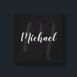 Black personalised Monogram and Name Canvas Print<br><div class="desc">Personalised Monogram and Family Name Gift
featuring name in white modern script font style and monogram in grey modern script font style as background on black background.</div>