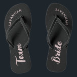 Black Pink Name Bride Bridal Party Bachelorette Flip Flops<br><div class="desc">A simple black and pink minimalist typography design for a bridal shower, bachelorette party or beach wedding. The text is customisable and can be personalised with your own name and bride slogan. For example, Bride Squad instead of Team Bride, Bride repeated on the left and right foot, or something else....</div>