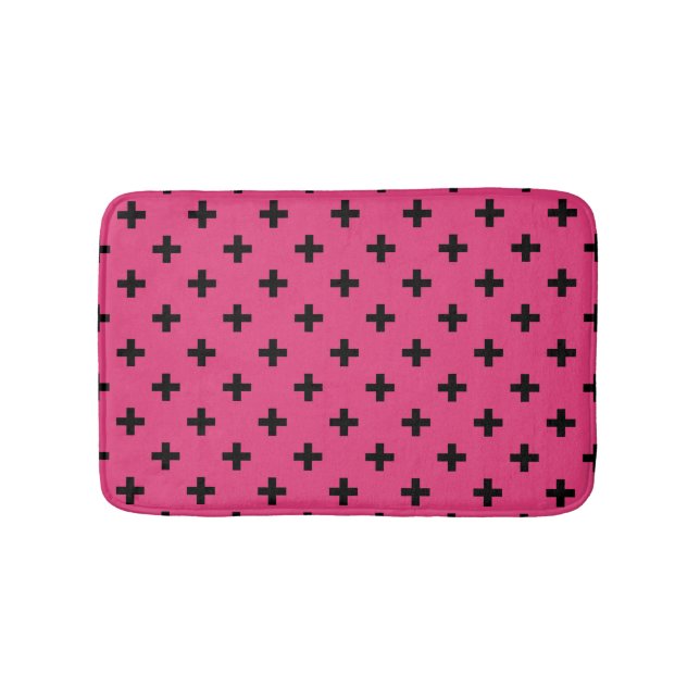 Black polka crosses on fuchsia bath mat (Front)