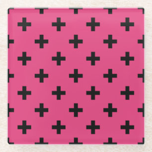 Black polka crosses on fuchsia glass coaster