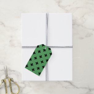 Black polka crosses on green gift tags