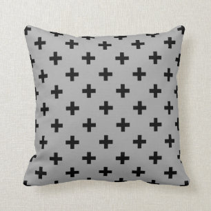 Black polka crosses on grey cushion