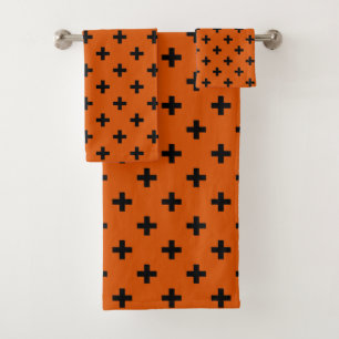 Black polka crosses on orange bath towel set