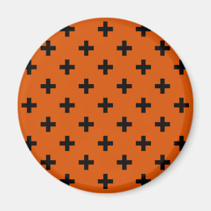 Black polka crosses on orange magnet