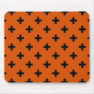 Black polka crosses on orange mouse mat