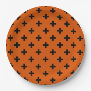 Black polka crosses on orange paper plate