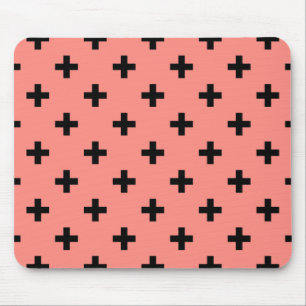 Black polka crosses on peach mouse mat