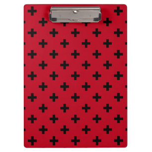 Black polka crosses on red clipboard