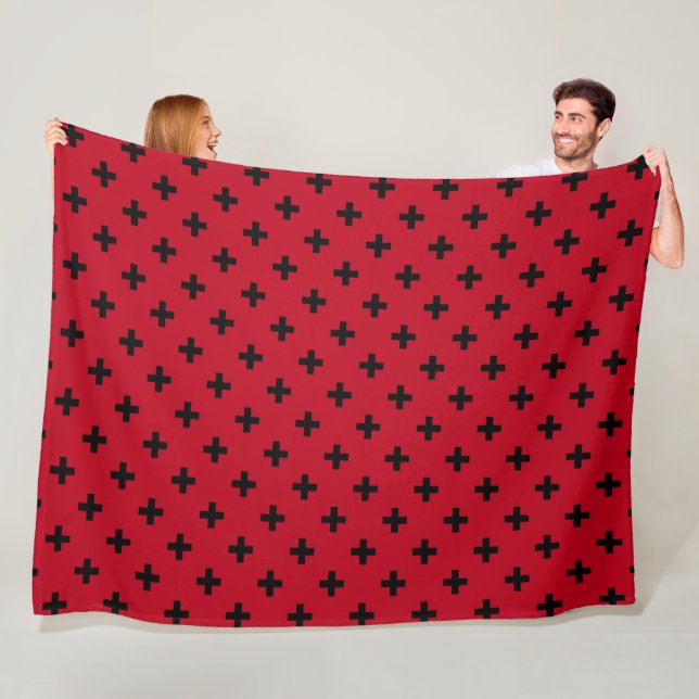 Black polka crosses on red fleece blanket (In Situ)
