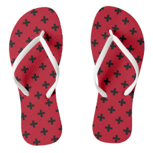 Black polka crosses on red flip flops