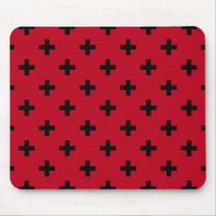 Black polka crosses on red mouse mat